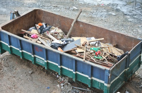 Recycling bins and sorted waste at Sydenham Skip Hire facility entrance